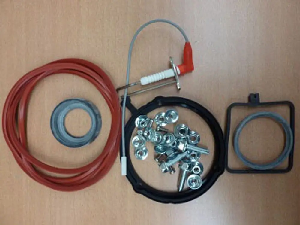 Baukit mit verschiedenen Schrauben, Dichtungen, Kabeln und einer Zündkerze, geeignet für Remeha Produkte zur Wartung oder Reparatur.
